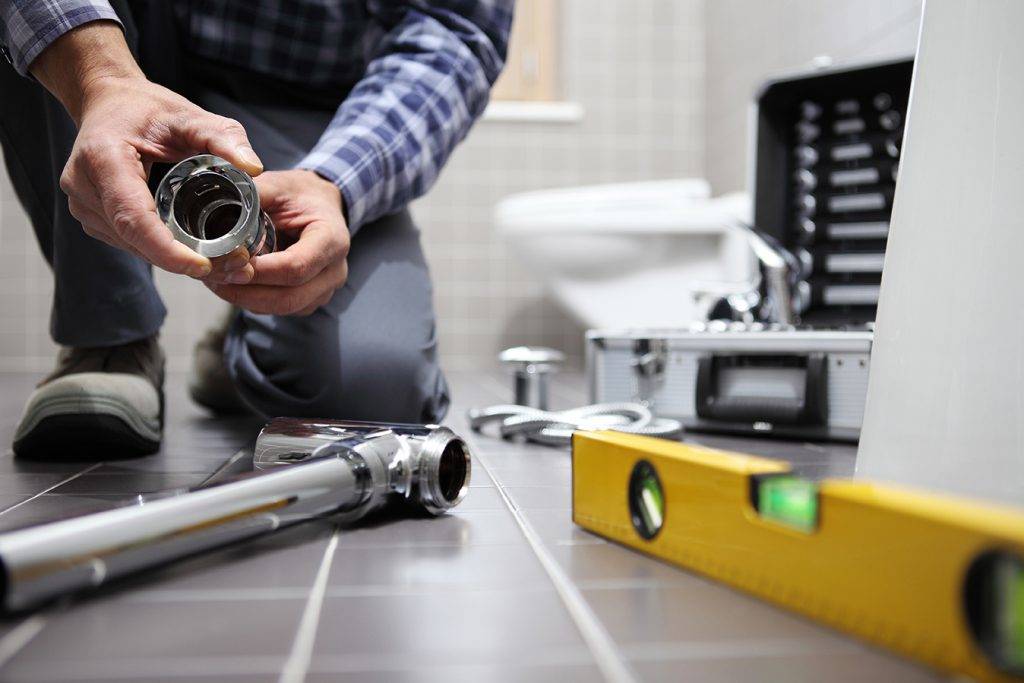 Plumber At Work Installing A Bathroom 2